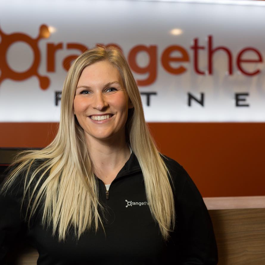 Kristen inside of an Orangetheory Fitness studio